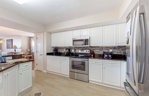 North Myrtle Beach Condo | Inviting waterfront condo with pool, hot tub, golf, balcony, & W/D