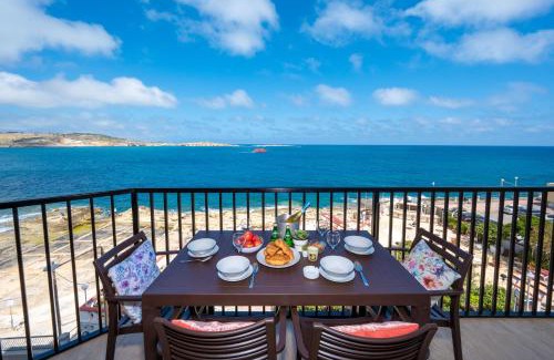 Bugibba Apartment | Islet Promenade Seafront Apartment with large Corner Terrace by Getawaysmalta