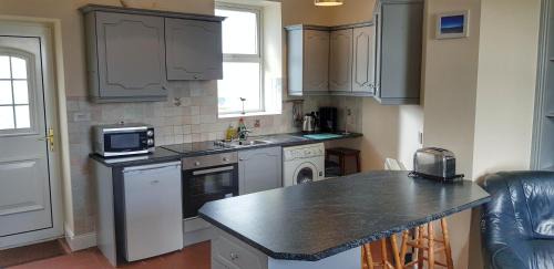 Cromane House | Jacks' Coastguard Cottage Vacation home