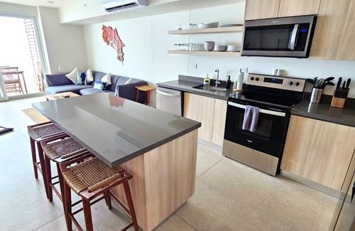 Jaco Condo | Jaco Beachfront Oasis 2-bedroom condo on Jaco Beach with AC, fitness room, WiFi