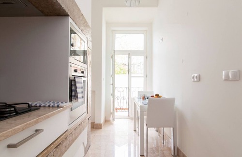 Santa Maria Maior Apartment | JOIVY Elegant 3BR Apt w/terrace in Baixa, 3mins to Lisbon Cathedral