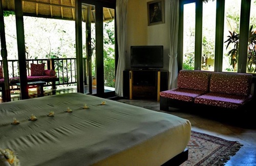 Sukawati House | Junior Suite room in Sukawati, surrounded by lush gardens