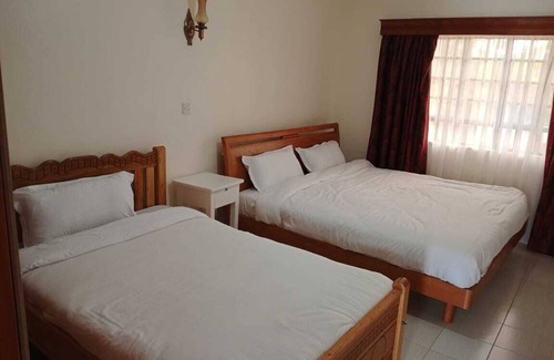 Muiga Hotel | Juniper Green Gardens Resort