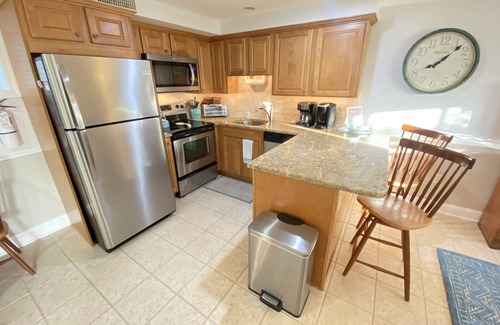 Cape May Condo | JUST ACROSS THE STREET FROM THE BEACH! PARK YOUR CAR & WALK! Granite countertops and stainless appliances. In ground pool at property.