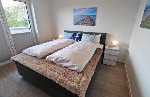 Tossens Apartment | KÜSTE33/48 – Penthousewohnung mit Dachterrasse, Sauna - strandnah!