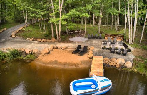 Lac-Superieur Ski Chalet | KALLM-Mont-Tremblant chalet with hot tub, pond & beach on private 7acre estate