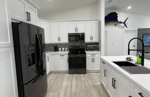Sexton Cove Estates House | Key Largo Waterfront Paradise! 90 ft. dock, Bikes, Kayaks, and More!