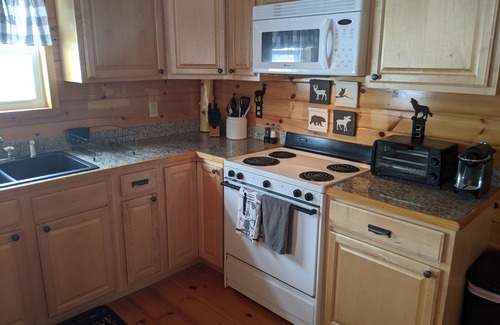 Oquossoc House | Knotty Pine Home- 2 Min Walk to Lake and Dock