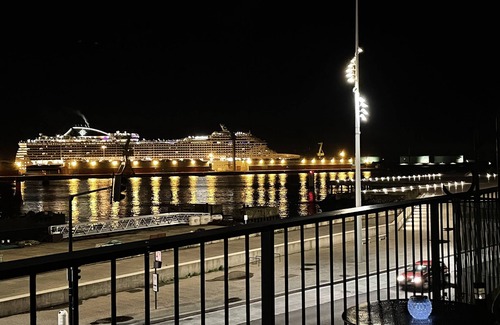 Downtown Le Havre Apartment | l'ANCRE Studio Perret with balcony in front of the harbor entrance.