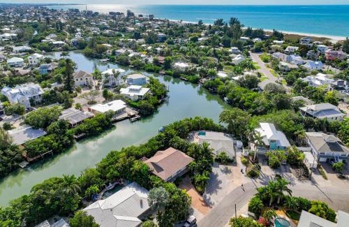Anna Maria House | La Buena Vida - Bright Beachy Canal Front Steps to Beach PoolSpa Dock Beach Gear Dogs OK
