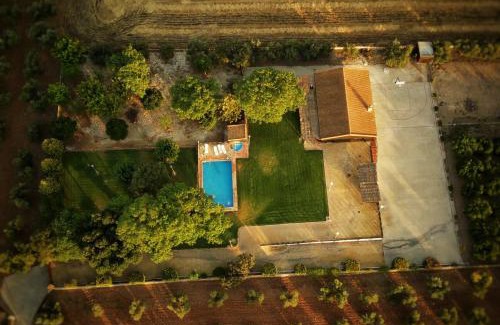 La Carlota House | La Cabaña piscina y jardín