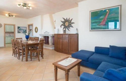 La Conia Apartment | [La Conia Beach House]: Appartamento di Lusso con Terrazza sul Mare