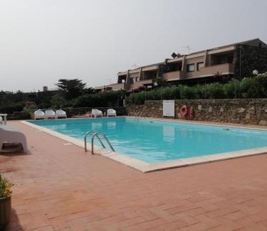 La Pelosa Apartment | La Finestra su Stintino 5 Appartamento con veranda vista mare e piscina