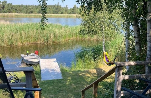 Tofta Cabin | Lake cottage by the sea with its own lake plot, jetty and boat