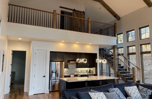 Nebo House | Lake front home with dock in a small cove with a beach.