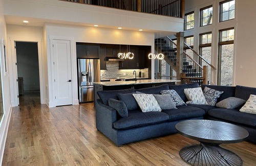Nebo House | Lake front home with dock in a small cove with a beach.