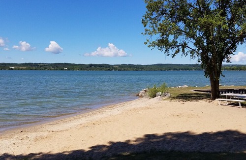 Traverse City Cabin | Lake Leelanau Waterfront Cottage with Mini Harbor - Close to Traverse City!