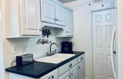 Little Kowaliga House | Lake Martin Boathouse great for couples: steps to the dock. Paddleboat included.