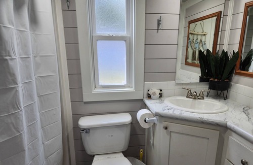 Berryville Cabin | Lake Side Tiny Home, large deck.
