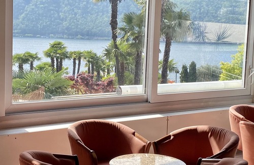 Bissone Apartment | Lake view apartment with terrace, outdoor pool and parking space