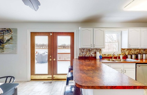 Portage House | Lake-view home with private hot tub, deck