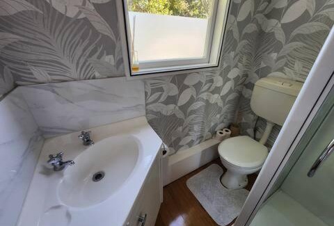 Ngongotaha House | Lake view room with bathroom