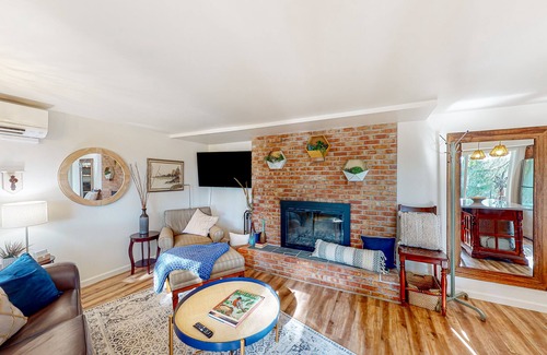 Maple Heights-Lake Desire Apartment | Lake view suite with beautiful setting, fireplace, firepit & tree-lined patio