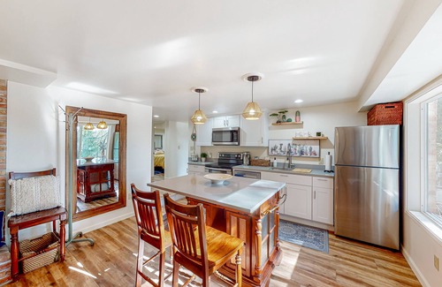 Maple Heights-Lake Desire Apartment | Lake view suite with beautiful setting, fireplace, firepit & tree-lined patio