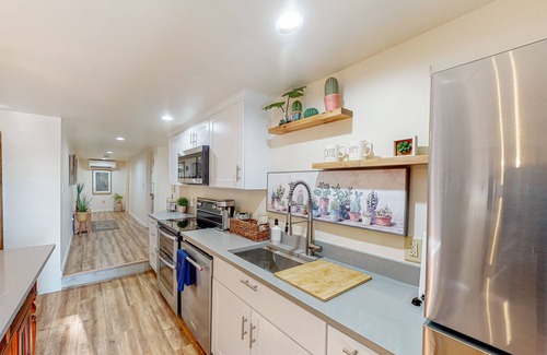 Maple Heights-Lake Desire Apartment | Lake view suite with beautiful setting, fireplace, firepit & tree-lined patio