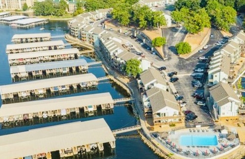 Lake Ozark Apartment | Lakefront Relaxing stay with boat ramp, slip, indoor, outdoor pool and hot tub