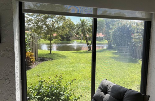 Pelican Bay House | Lakefront 3 bedroom, 2 bath home in gated community. Walking distance to beach.