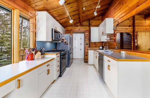 Sand Lake House | Lakefront Anchorage home with fireplaces, jetted tub & private dock