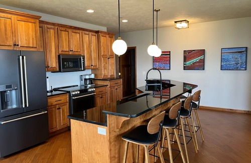 Arnolds Park Condo | Lakefront BB Corner Condo.nExpanded deck & panoramic views & 6 waterpark passes.