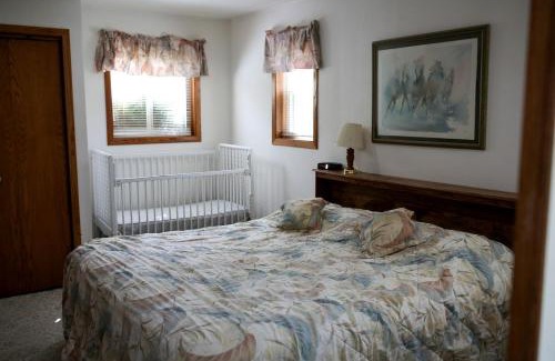 Tomah House | Lakefront Cabin Rental with a Paddle Boat near Wisconsin Dells, Wisconsin