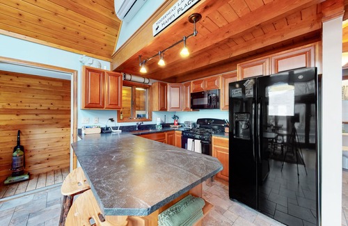 Greenville House | Lakefront Chalet-Style Home with Large Deck, a Dock & Beautiful Lake Views