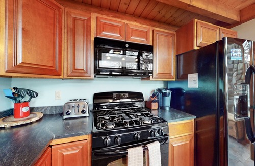 Greenville House | Lakefront Chalet-Style Home with Large Deck, a Dock & Beautiful Lake Views