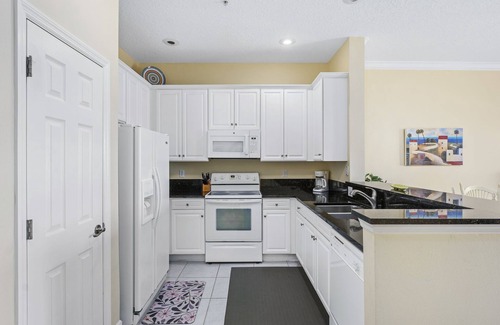 Palm Coast Condo | Lakefront Condo with Balcony Dining, Heated Pools, Beach Access