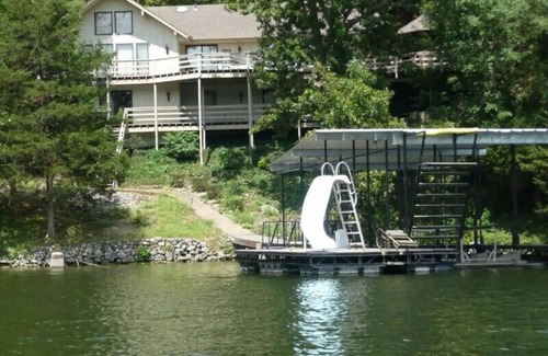 Lake Ozark House | Lakefront ENHANCED CLEANING 4 BR,/5 Bath Game Room, water slide, paddle boat