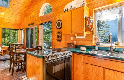 Port Angeles Cabin | Lakefront home with stunning views, private hot tub, dock & 2-story deck