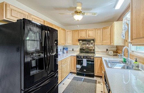 Bumpass House | Lakefront home with boat mooring, deck, hot tub, game room & fast WiFi - dogs OK