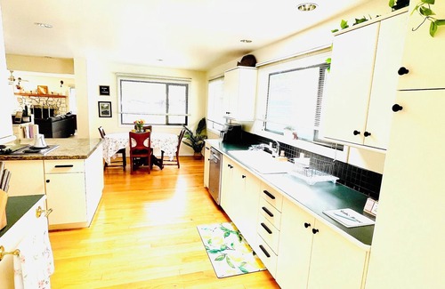 Youbou House | Lakefront home with tennis court & private dock & big back deck & sandy beach
