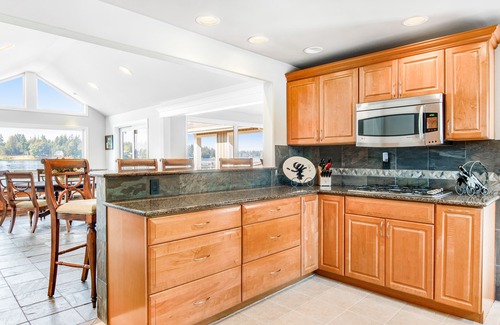 Bonney Lake House | Lakefront house with built-in bar & grill, fireplace, beach, & dock