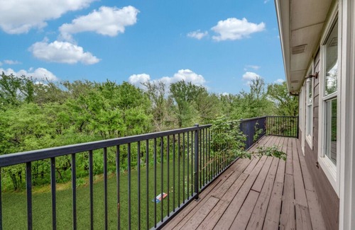 Little Elm House | Lakefront retreat just steps from Lake Lewisville! Enjoy 341 ft of shoreline, a private cove, sandy beach, fire pit, and pergola with built-in grill. Inside: lake views, travertine floors, cozy fireplace, and an upstairs game room with balcony.