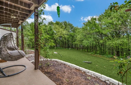 Little Elm House | Lakefront retreat just steps from Lake Lewisville! Enjoy 341 ft of shoreline, a private cove, sandy beach, fire pit, and pergola with built-in grill. Inside: lake views, travertine floors, cozy fireplace, and an upstairs game room with balcony.