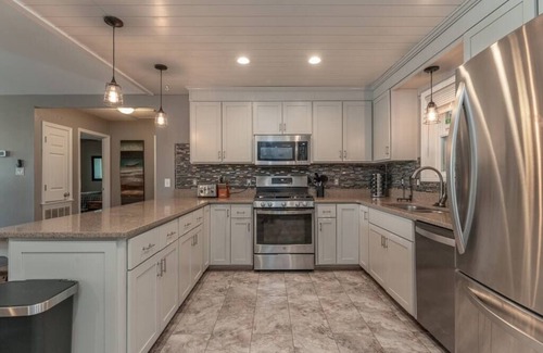 Goodview House | Lakefront Retreat with Game Room, Hot Tub, and Gym!