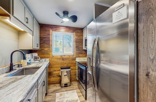McHenry House | Lakefront townhouse near lake & skiing with hot tub & wood-burning fireplace