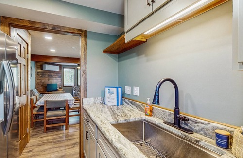 McHenry House | Lakefront townhouse near lake & skiing with hot tub & wood-burning fireplace
