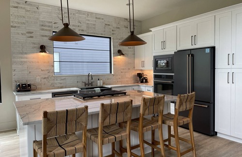Winchester House | Lakeshore Modern! Lake front with platform dock and 2 kayaks, firepit and views