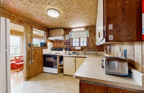 Malletts Bay House | Lakeside cottage w/mountain views, canoes, firepit, enclosed porch, bbq, beach