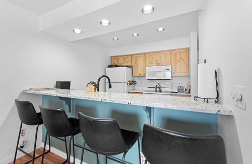 Lakeside Village Condo | Lakeside Village Condo w/Private Patio for Mountain Views & Shared Hot Tub!
